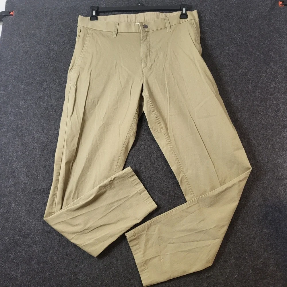 Fabletics The One Pant Mens 34x34 Khaki Tan Stretch Chino PT2354910-3487-34034